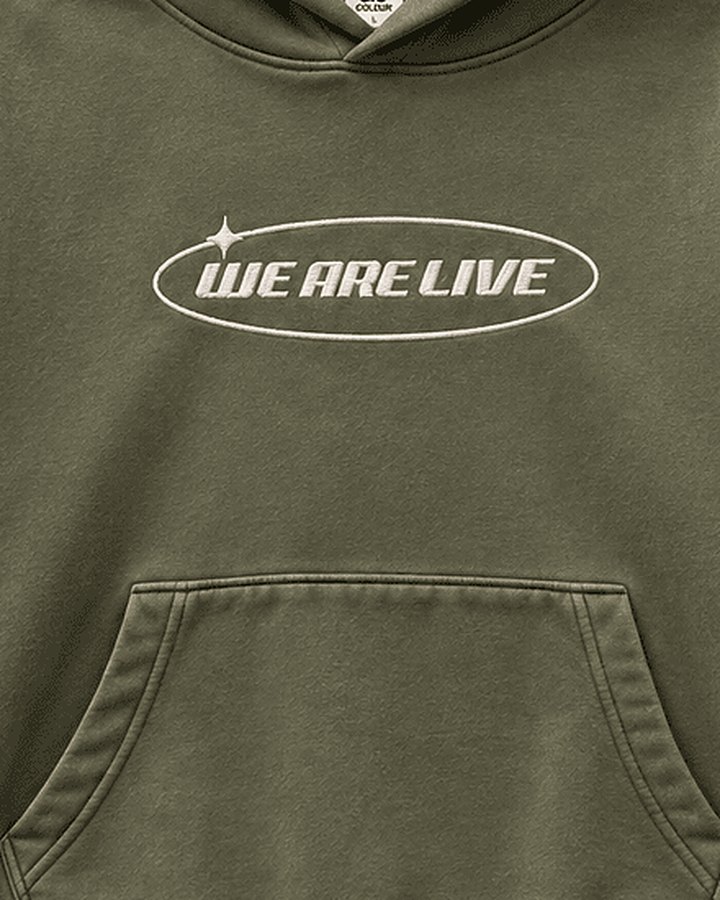 Close-up of the embroidered We Are Live chest logo